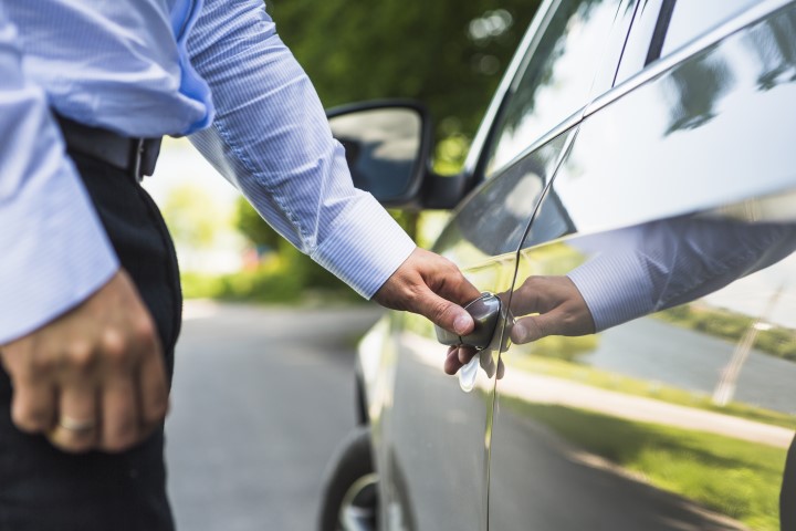 man-s-hand-opening-car-door